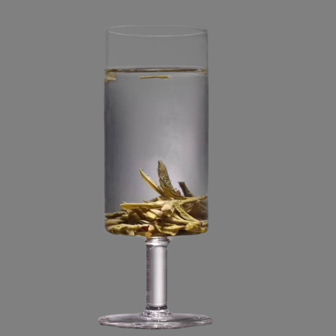 HANDMADE FOOTED GLASS TEA CUP