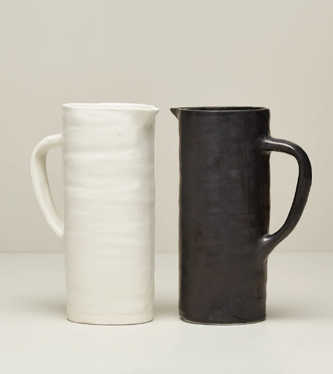 BARE PITCHER IN WHITE