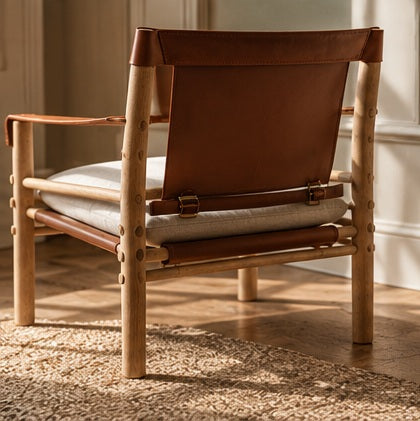 PISINOE LEATHER CHAIR ("THE PERSUASIVE ONE")