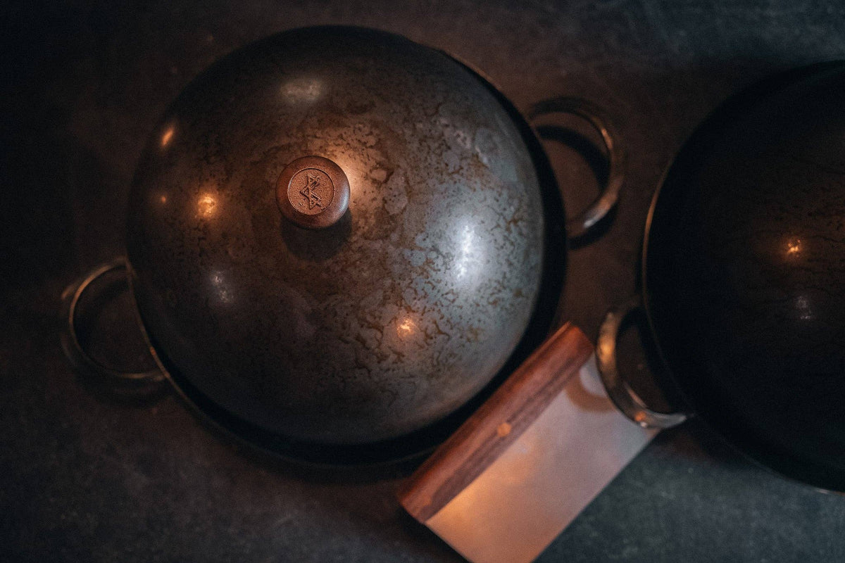 Spun carbon steel bread cloche with wooden knob for rustic home baking