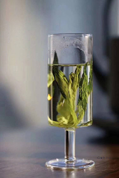 HANDMADE FOOTED GLASS TEA CUP